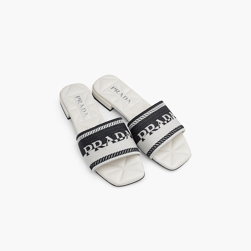 PRADA Women Embroidered Lettering Logo Slides in Black-Chalk White with Quilted Sole - Lovelo Room