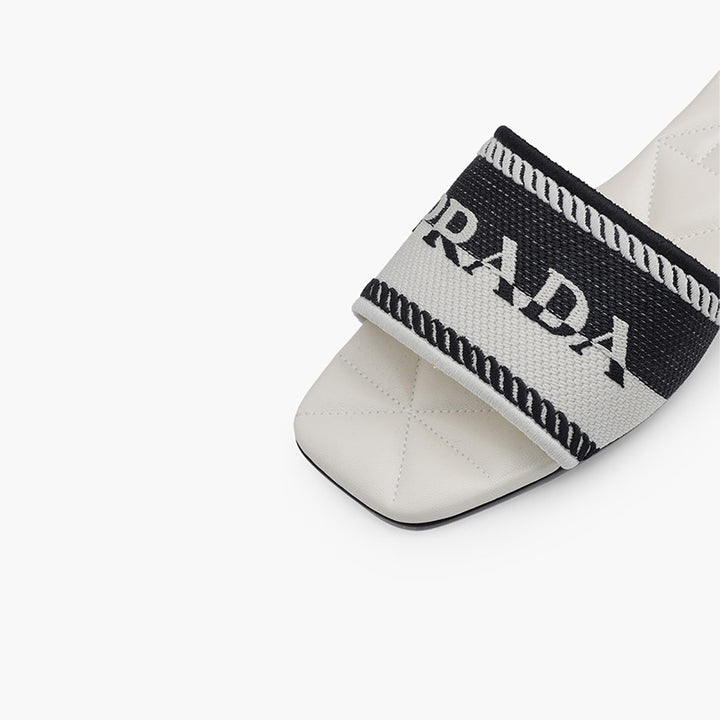 PRADA Women Embroidered Lettering Logo Slides in Black-Chalk White with Quilted Sole - Lovelo Room